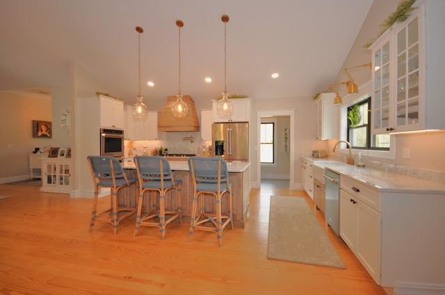 kitchen featuring a large island, white cabinets, and appliances with stainless steel finishes