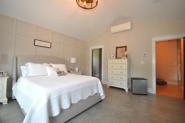 bedroom featuring an AC wall unit and lofted ceiling