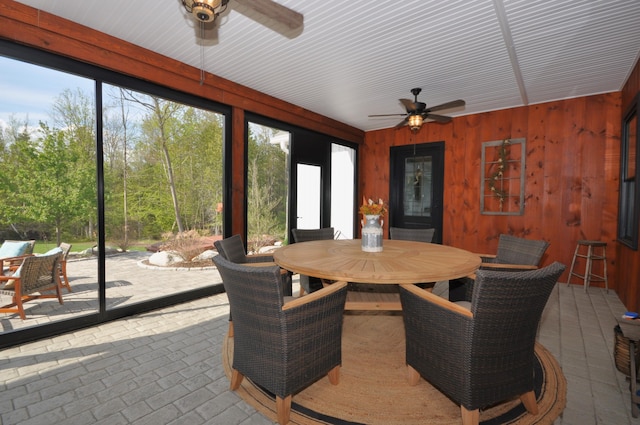 sunroom featuring a wealth of natural light and ceiling fan