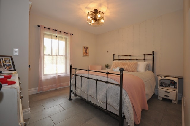 bedroom featuring dark tile patterned flooring