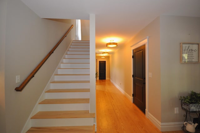 stairway featuring hardwood / wood-style flooring