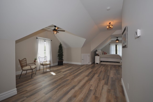 bonus room with dark hardwood / wood-style flooring, ceiling fan, and lofted ceiling