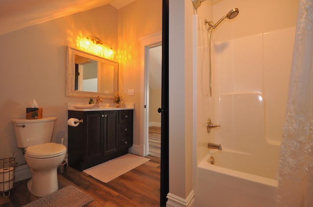 full bathroom with shower / tub combination, vanity, hardwood / wood-style flooring, and toilet