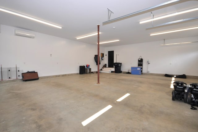 garage featuring a wall unit AC