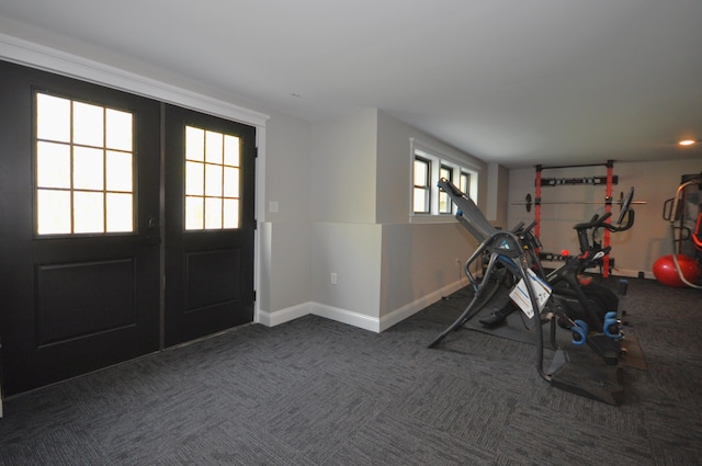 workout room with dark carpet