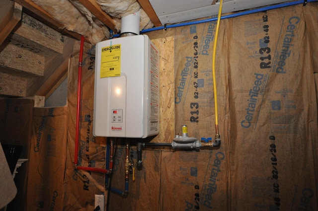 utility room featuring tankless water heater