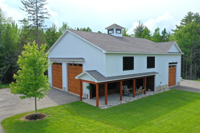 view of front of home featuring a patio area and a front lawn