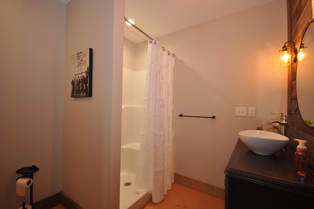 bathroom with a shower with curtain and vanity