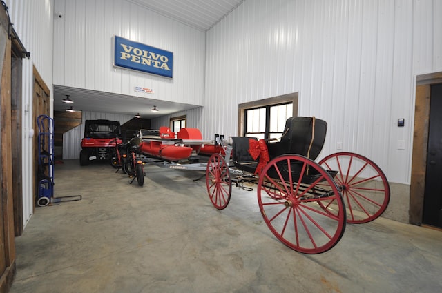 garage featuring wooden walls