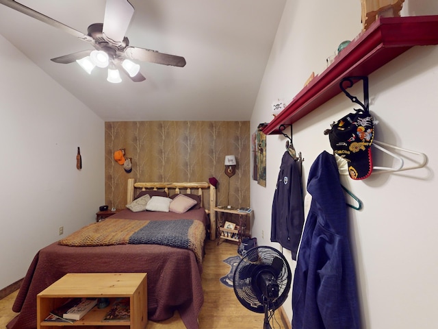 bedroom featuring lofted ceiling and ceiling fan