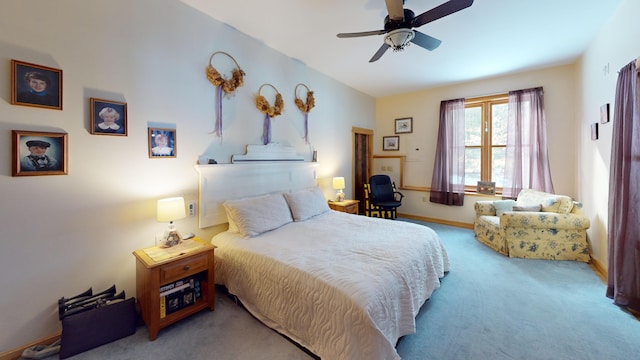 bedroom featuring ceiling fan and light carpet