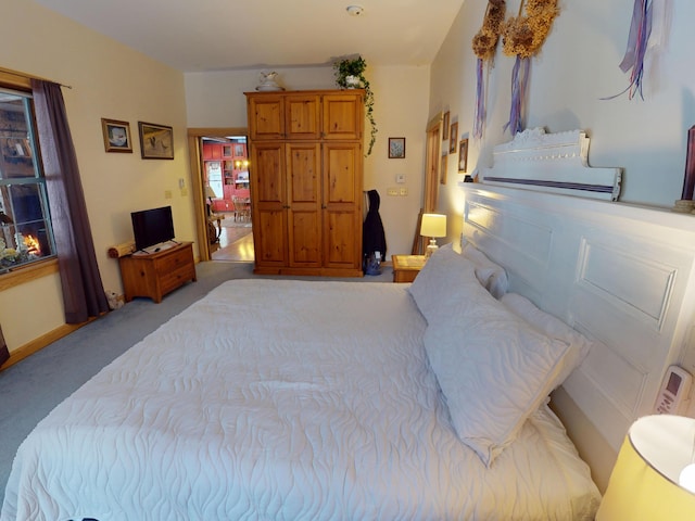 bedroom featuring light carpet