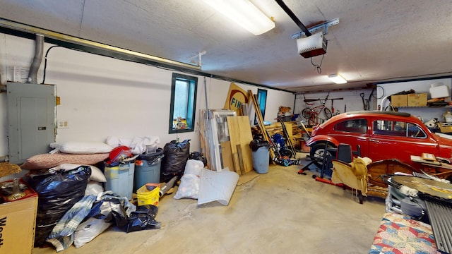 garage featuring a garage door opener and electric panel