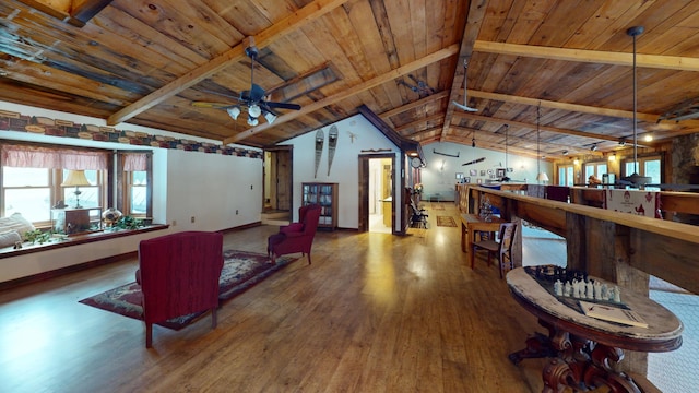 living room featuring vaulted ceiling with beams, ceiling fan, wood-type flooring, and wooden ceiling