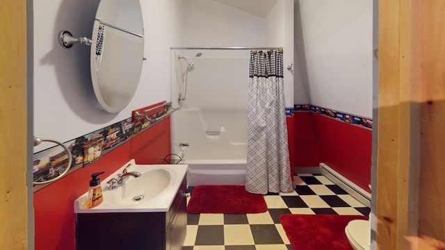 full bathroom featuring lofted ceiling, shower / bath combo, baseboard heating, vanity, and toilet