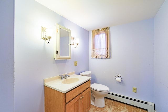 bathroom featuring vanity, a baseboard radiator, and toilet