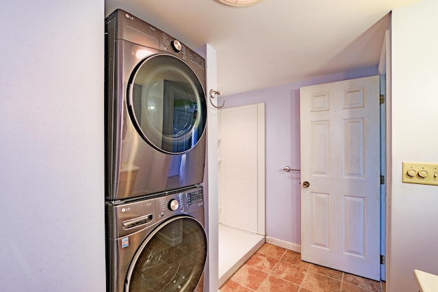 washroom with stacked washer / dryer