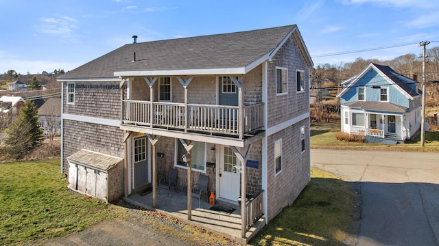 view of front of house featuring a balcony