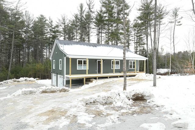 view of front of house featuring covered porch and a garage