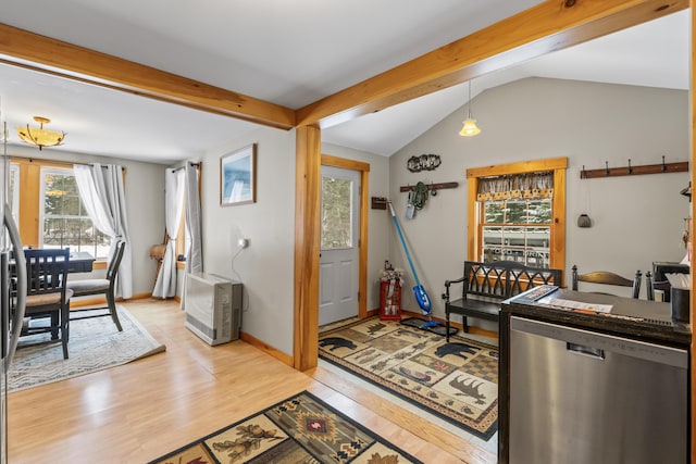 foyer entrance with lofted ceiling and light wood-type flooring