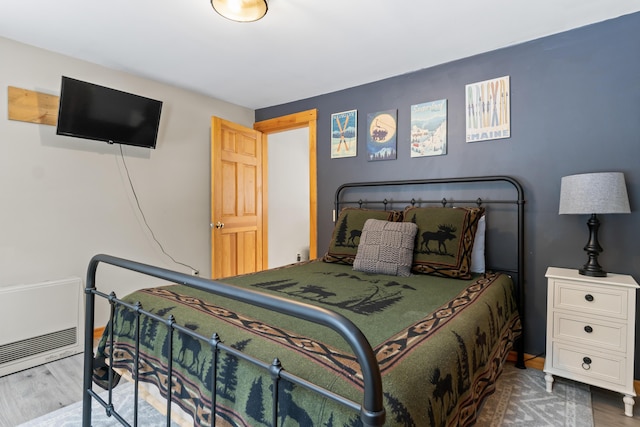 bedroom with wood-type flooring