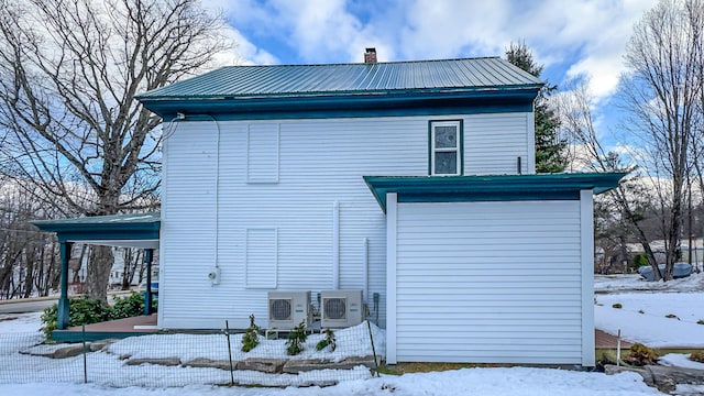 20 N High St, Bridgton, ME 04009 - view of snowy exterior featuring ac unit
