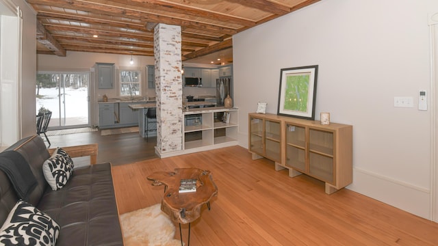 20 N High St, Bridgton, ME 04009 - living room with beamed ceiling, wood-type flooring, wood ceiling, and sink