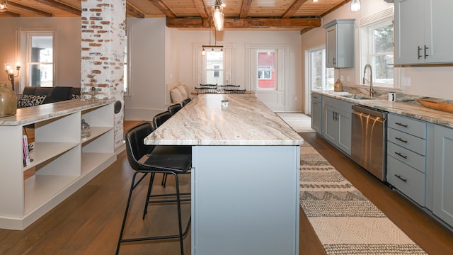 20 N High St, Bridgton, ME 04009 - kitchen with beam ceiling, stainless steel dishwasher, decorative light fixtures, a kitchen island, and wood ceiling