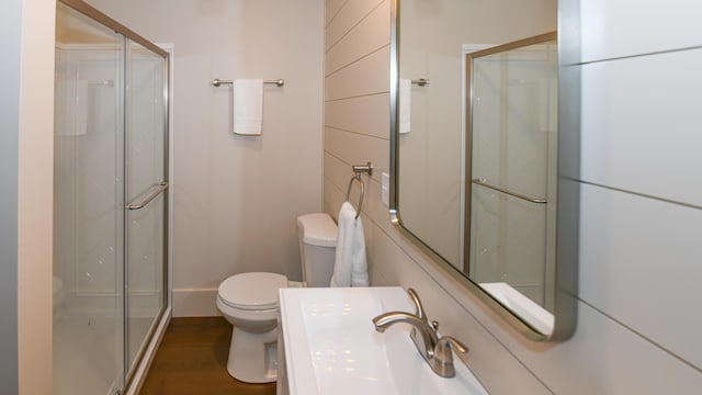 20 N High St, Bridgton, ME 04009 - bathroom with hardwood / wood-style flooring, toilet, and walk in shower