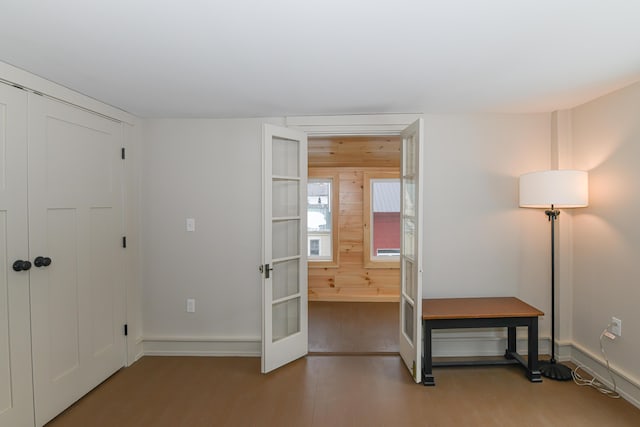 20 N High St, Bridgton, ME 04009 - unfurnished bedroom with french doors, connected bathroom, and wood-type flooring