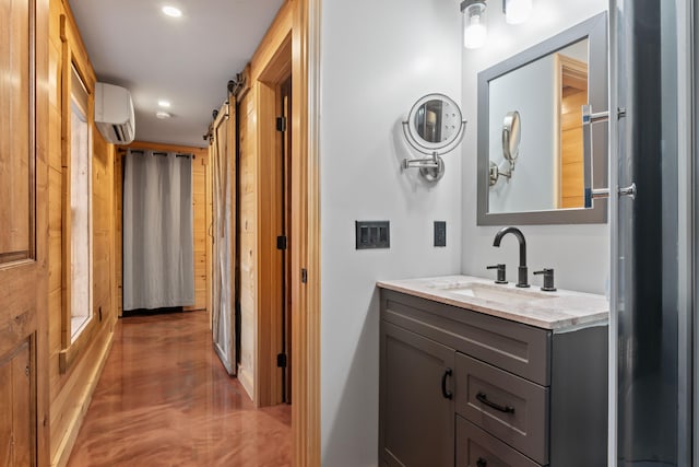 18 Severin Way, Limerick, ME 04048 - bathroom featuring a wall mounted AC, vanity, and recessed lighting