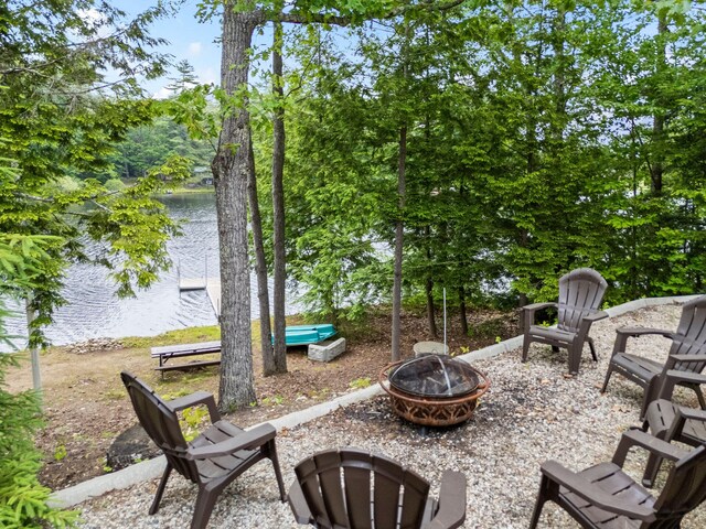 18 Severin Way, Limerick, ME 04048 - view of patio featuring an outdoor fire pit and a water view