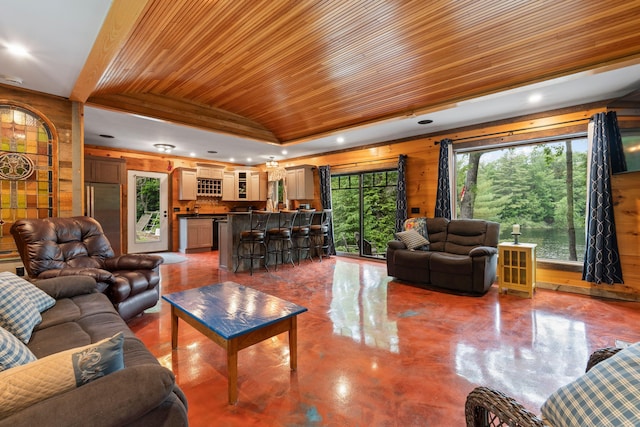 18 Severin Way, Limerick, ME 04048 - living area with wood ceiling, concrete flooring, recessed lighting, and wood walls
