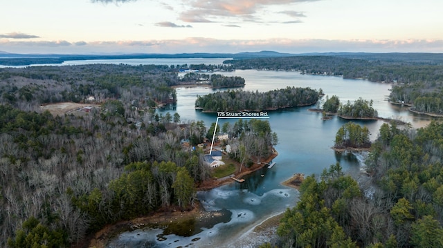 aerial view at dusk with a water view