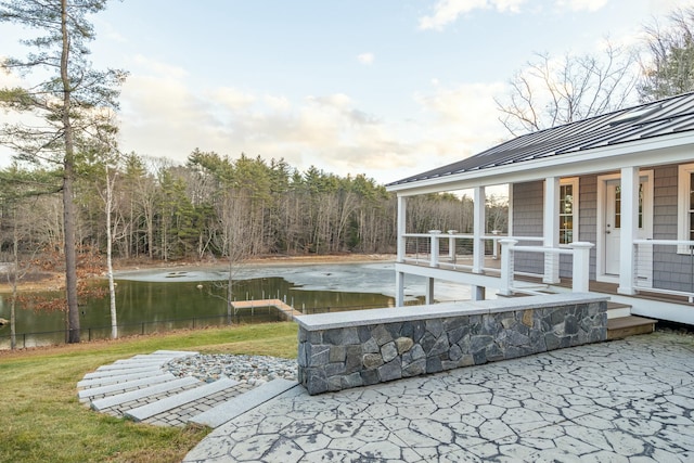 view of swimming pool with a water view