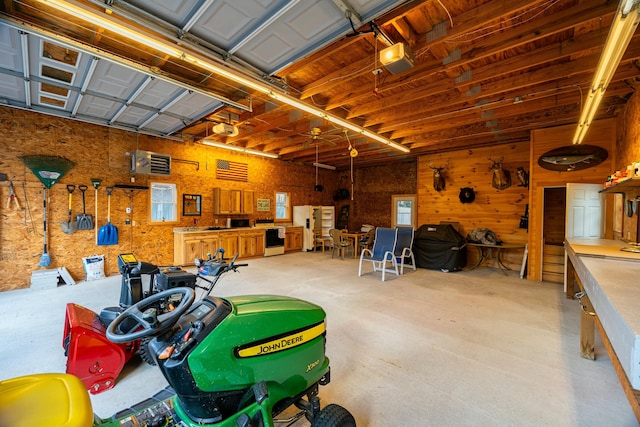 garage featuring white refrigerator and a garage door opener