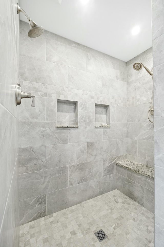 bathroom with tiled shower