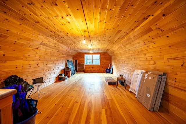 bonus room with wooden ceiling, light wood-type flooring, and vaulted ceiling