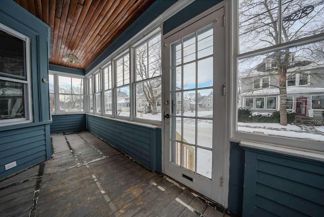 unfurnished sunroom with plenty of natural light and wooden ceiling