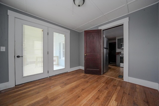 empty room featuring wood-type flooring