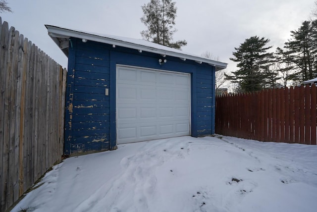 view of snow covered garage