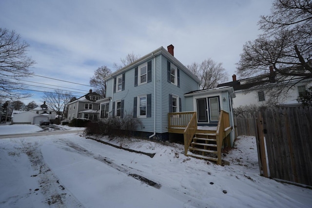 view of front of property with a wooden deck