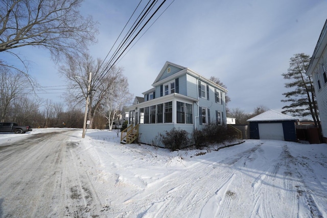 view of front of property with an outbuilding and a garage