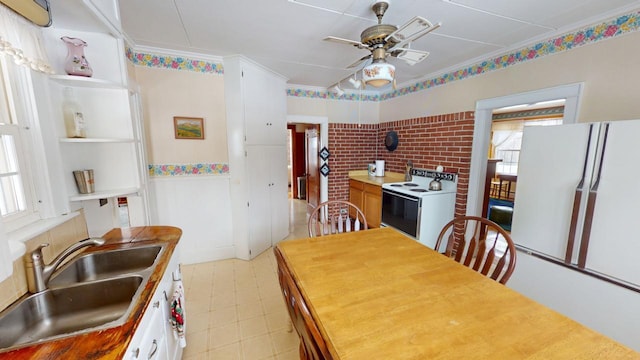 90 E Ter, Millinocket, ME 04462 - kitchen featuring electric range, a ceiling fan, a sink, and white cabinets