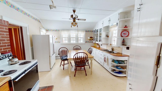 90 E Ter, Millinocket, ME 04462 - kitchen with open shelves, white appliances, a sink, white cabinets, and light countertops