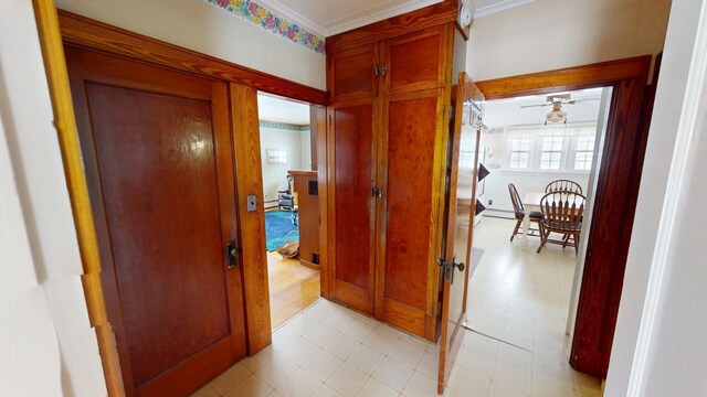 90 E Ter, Millinocket, ME 04462 - corridor featuring ornamental molding and a baseboard heating unit