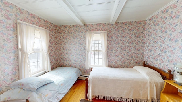 90 E Ter, Millinocket, ME 04462 - bedroom featuring beamed ceiling, wood finished floors, a baseboard radiator, and crown molding