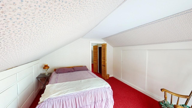 90 E Ter, Millinocket, ME 04462 - bedroom featuring vaulted ceiling, carpet, and a closet
