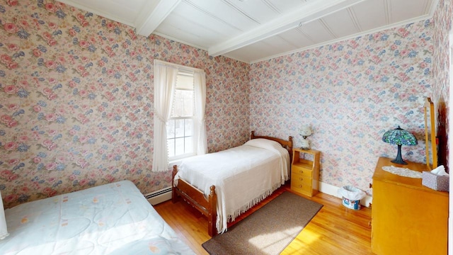 90 E Ter, Millinocket, ME 04462 - bedroom featuring wood finished floors, beam ceiling, a baseboard heating unit, crown molding, and baseboards