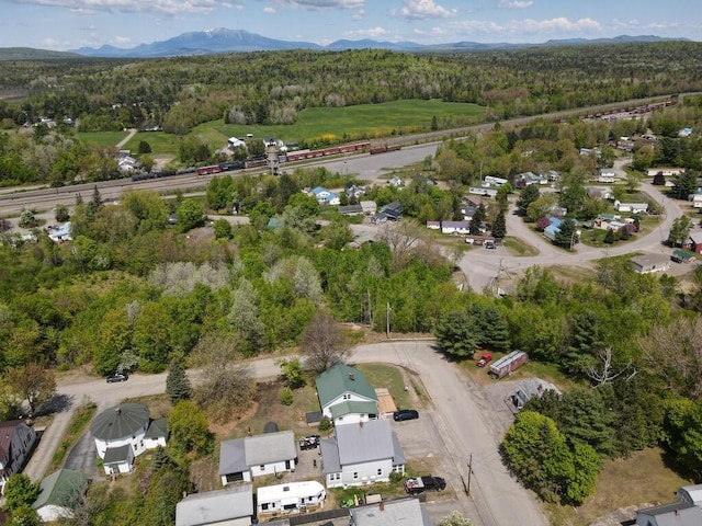 90 E Ter, Millinocket, ME 04462 - aerial view of property and surrounding area with a heavily wooded area and mountains